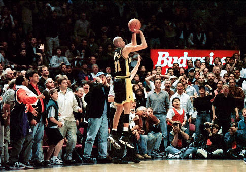 Indiana Pacers' Reggie Miller shoots a three-pointer with 5.1 seconds left in regulation to tie Game 4 of the Eastern Conference semifinals with the New York Knicks at Madison Square Garden in New York Sunday, May 10, 1998. The Pacers went on to win the game 118-107 and take a 3-1 lead with Game 5 in Indianapolis Wednesday. ( Photo Credit: The Indianapolis Star/Paul Sancya) Original Filename: AP9805100832.jpg